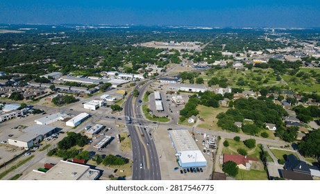 Irving Boulevard intersects busy multi lane roads surrounded by service stations across North Texas. Business parks and commercial plazas occupy regional transit sectors, Irving, Texas. USA
