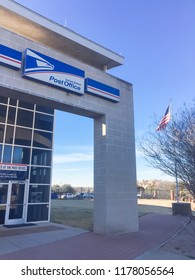 IRVING, TX, USA-FEB 2, 2018:Close-up Brand Logo At Exterior Of USPS Store Cloud Sky. The United States Postal Service Is An Independent Agency Of US Federal Government Providing Postal Service