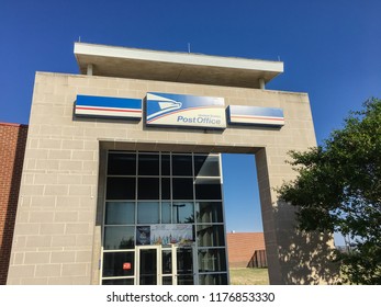 IRVING, TX, USA-SEP 2, 2018:Close-up Brand Logo At Exttorior Of USPS Store Clear Blue Sky. The United States Postal Service Is An Independent Agency Of US Federal Government Providing Postal Service