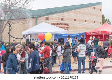 IRVING, TX, US-JAN 27, 2018: 2nd Annual Frost Fest At Cimarron Park. A Free Winter Festival Offering Family Fun Activities. Diverse People, Crowded Enjoy Complimentary Snow Play Area With Fresh Snow