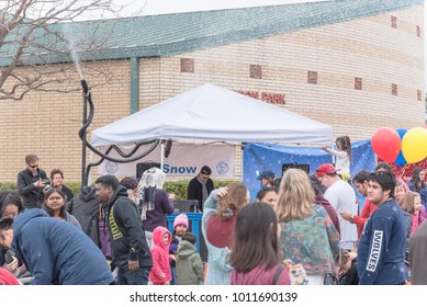 IRVING, TX, US-JAN 27, 2018: 2nd Annual Frost Fest At Cimarron Park. A Free Winter Festival Offering Family Fun Activities. Diverse People, Crowded Enjoy Complimentary Snow Play Area With Fresh Snow