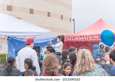 IRVING, TX, US-JAN 27, 2018: 2nd Annual Frost Fest At Cimarron Park. A Free Winter Festival Offering Family Fun Activities. Diverse People, Crowded Enjoy Complimentary Snow Play Area With Fresh Snow