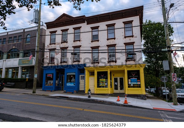 Irvington, NY / USA -\
October 1 2020: Store fronts on Main Street during the late\
afternoon in Irvington,\
NY