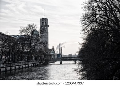 Isar River Munich With View To Well Known Deutsches Museum And  Bridge In Winter. Black And White.