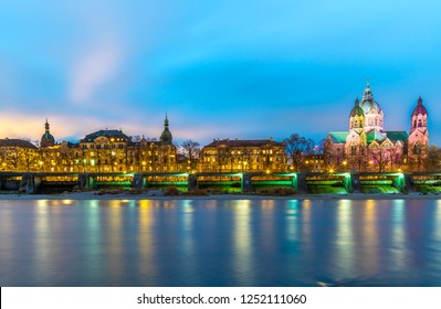 Isar River And St. Luke's Church At Night In Munich. Munich Germany Skyline View.