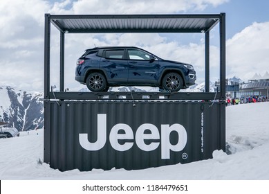 Ischgl, Austria - January 20, 2018: Dark blue Jeep Compass displayed at dramatic snowy mountain scenery
