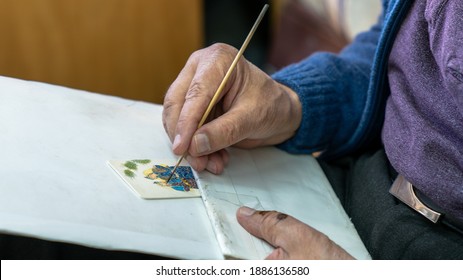 Isfahan, Iran - April 2019: Senior Artist Painting Traditional Iranian Miniature