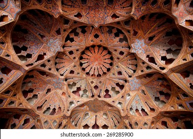 ISFAHAN, IRAN - OCT 18: Antique ceiling with music instruments patterns in famous palace Ali Qapu on October 18, 2014. Safavid era palace Ali Qapu was built in early seventeenth century in Esfahan