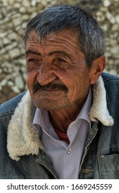 Ishkoshim, Tajikistan - June 20, 2019: Portait Of An Old Man With Mustache In The Wakhan Valley At The Pamir Highway In Tajikistan.