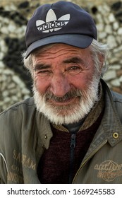 Ishkoshim, Tajikistan - June 20, 2019: Portait Of An Old Man With Mustache In The Wakhan Valley At The Pamir Highway In Tajikistan.