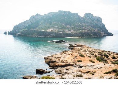 
Isla Del Fraile In Aguilas, Murcia, Spain. At Noon, Just When The Sun Is Over The Island.