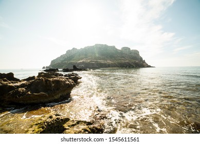 
Isla Del Fraile In Aguilas, Murcia, Spain. At Noon, Just When The Sun Is Over The Island.