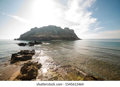 
Isla Del Fraile In Aguilas, Murcia, Spain. At Noon, Just When The Sun Is Over The Island.