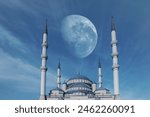 Islam Symbol, Mosque. Holy Islamic day or Ramadan concept background photo. Dark blue twilight sky and shining moon on background. Ankara - Kocatepe Camii