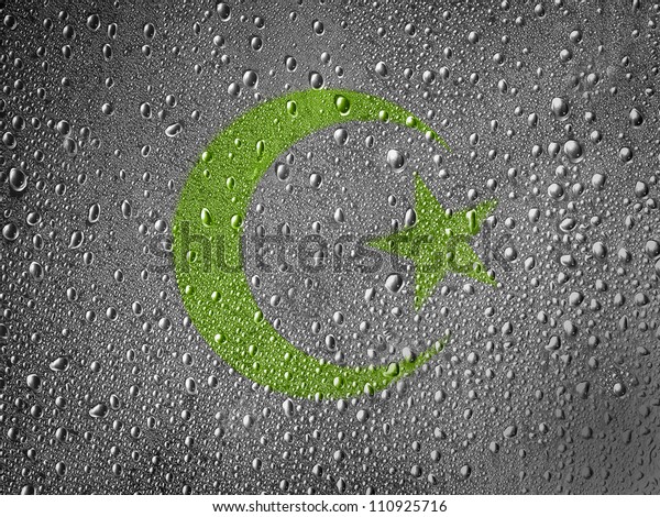 Islam symbol painted on metal surface covered with\
rain drops