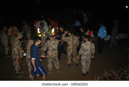 ISLAMABAD, PAKISTAN - APR 20: Soldiers Working At The Site Of The Plane Crash Near Pakistan's Capital City Of Islamabad That Killed All 127 Passengers And Crew Members. April 20, 2012 In Islamabad.