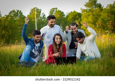 Islamabad.Pakistan 10th October 2019 Education, School And People Concept - Cheerful University Students With Laptop On Group Of Students.