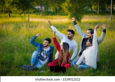 Islamabad.Pakistan 10th October 2019 Education, School And People Concept - Cheerful University Students With Laptop On Group Of Students.