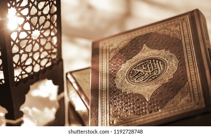 Islamic Book Koran with rosary on grey