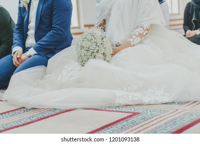 Islamic bride and groom marrying at a mosque