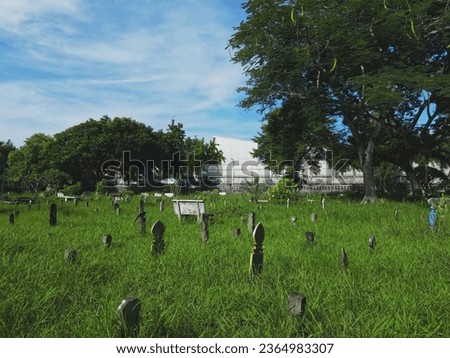 Islamic cemetery or kubor Green lawn, chairs, green stones calm the mind and mood.