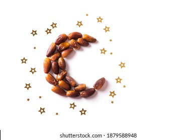 Islamic Crescent. Ramadan kareem with dates fruits arranged in shape of crescent moon isolated on white background, top view, copy space. Iftar food concept.