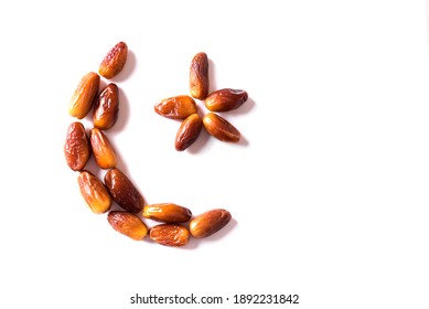 Islamic Crescent. Ramadan Kareem With Dates Fruits Arranged In Shape Of Crescent Moon Isolated On White Background, Top View, Copy Space. Iftar Food Concept.