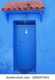 Islamic eave over door in african Chefchaouen town in Morocco in 2019 warm sunny spring day on April - vertical