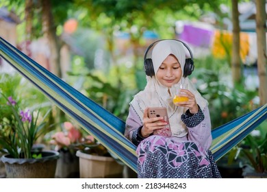 Islamic Girl Drinking Orange Juice
