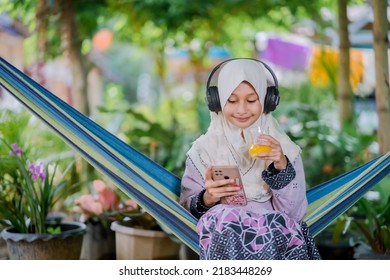 Islamic Girl Drinking Orange Juice
