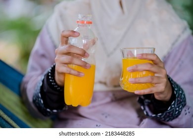 Islamic Girl Drinking Orange Juice
