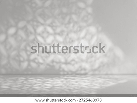 Islamic pattern arabesque overlay for Eid Mubarak,Ramadan background.Blurry shadow abstract geometry in muslim design on grey wall.Studio room with traditional ornament of window gobo light decoration