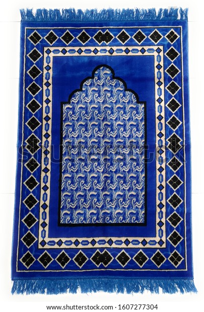 An Islamic prayer mat used by  Muslims to pray.\
This is a pure surface which is suitable for prayer. The prayer\
mats feature a Minwal design inspired by the great mosques of Mecca\
& Medina.