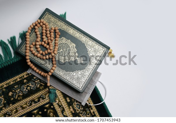 Islamic\
Scriptures with their equipment and a\
mask