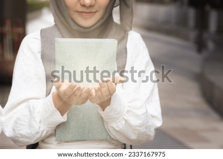 Islamic student, Pious Asian Muslim praying, Miracle of Religious Muslim schoolgirl with strong faith with prayer's hand concept