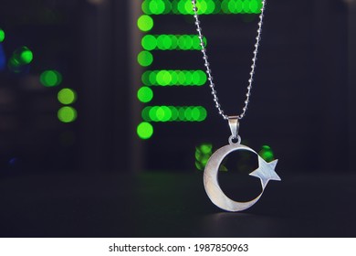 The Islamic symbol is a star with a crescent moon on the background of computer technology in the server room - Powered by Shutterstock