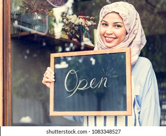 Islamic Woman Small Business Owner Holding Blackboard With Smiling