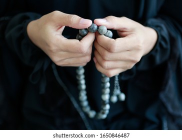 Islamic women pray inside mosque by holding beads and count to Allah. Bangkok Thailand Northeast Asia