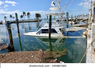 Islamorada, Florida / Monroe - 09/15/2017 Sunken Boat in a marina after Hurricane Irma.
