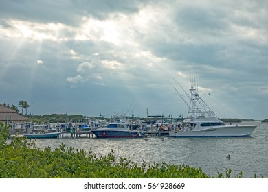 Islamorada Sun Rays Breaking Through Grey Clouds On Fishing Boat Marina