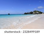 Island of Bermuda, Horseshoe Bay Beach with crashing waves, rocky coastline and pink sand