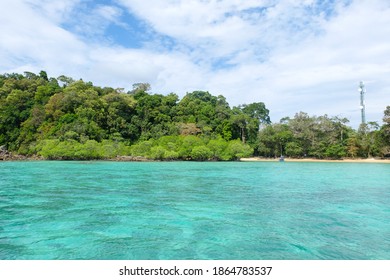 Tropical​ Island And Blue Sea Water With Blue Cloud​y​ Sky, Surin Island, Thailand.