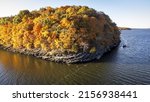 An island with colorful autumnal trees around the Grand Lake, Oklahoma