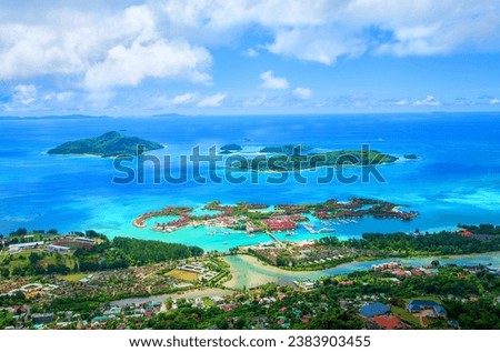 Island Mahe with Sainte Anne Marine National Park, Republic of Seychelles, Africa.
Capital city Victoria with Island Eden in the foreground. Sainte Anne Marine National Park with 8 islands in the midd