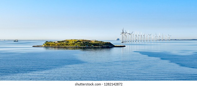 Island Middelgrundsfortet and offshore wind turbines on the coast of Copenhagen in Denmark