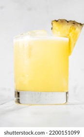 Island Oasis Cocktail Garnished With Pineapple Wedge