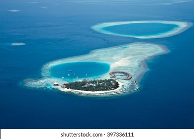 Island In The Ocean Maldives  From Aerial View.