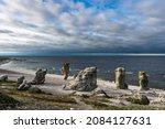 "Fårö Island" in Sweden. Rauks, ancient stone formations. Column like landform. Rauks often occur in groups called "rauk fields". Lots of famouse limestone rauks of Gotland in the Baltic Sea.