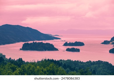 Islands in the sea on the horizon. Rocks in the sea during sunset. Beautiful rocky sea landscape in evening. Wild nature of Norway,  - Powered by Shutterstock