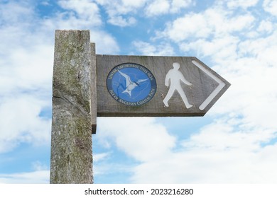 Isle of Anglesey coastal path sign in English and Welsh languages a 130 mile long walking trail around Anglesey in North Wales UK - Shutterstock ID 2023216280